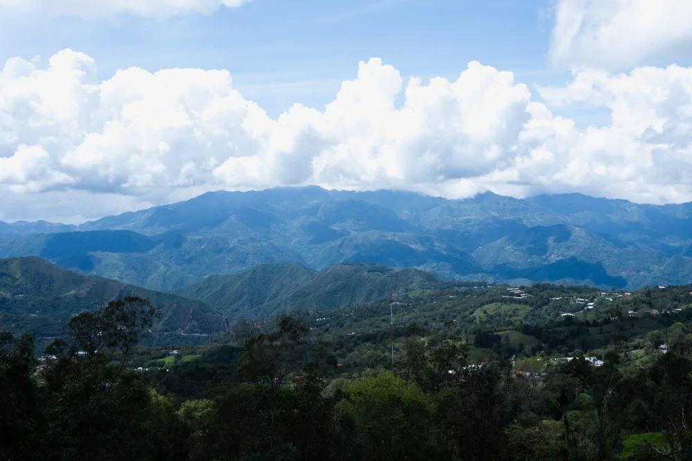 Mountain landscape with rolling green hills, Into Coffee Heartlands