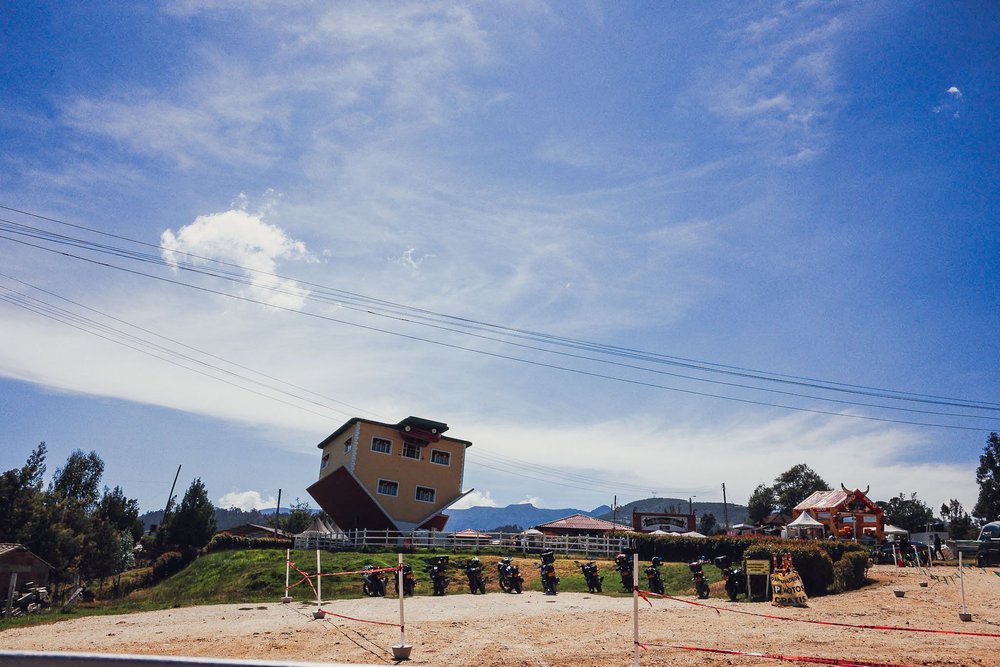 A tilted house on a grassy hill, Unseen Savannah