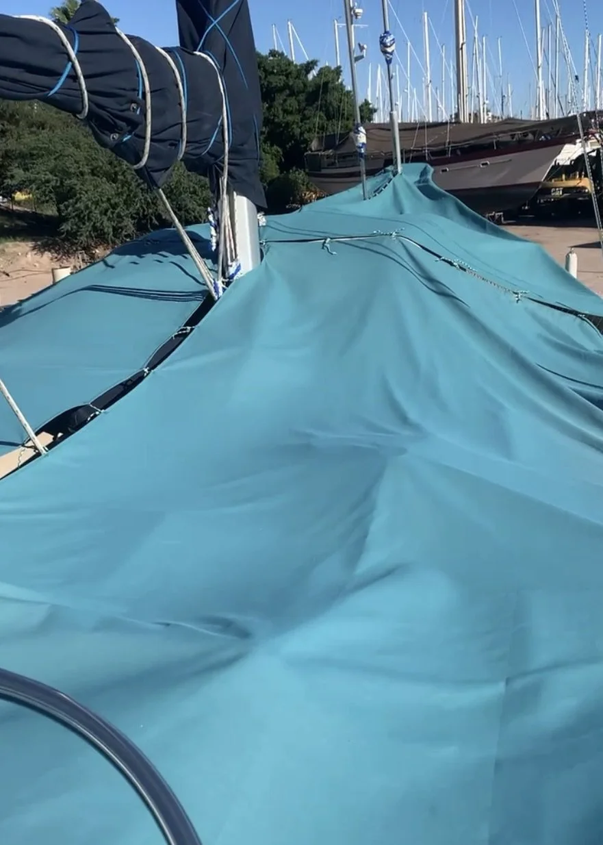 Full-deck cover for UV protection during summer storage.
