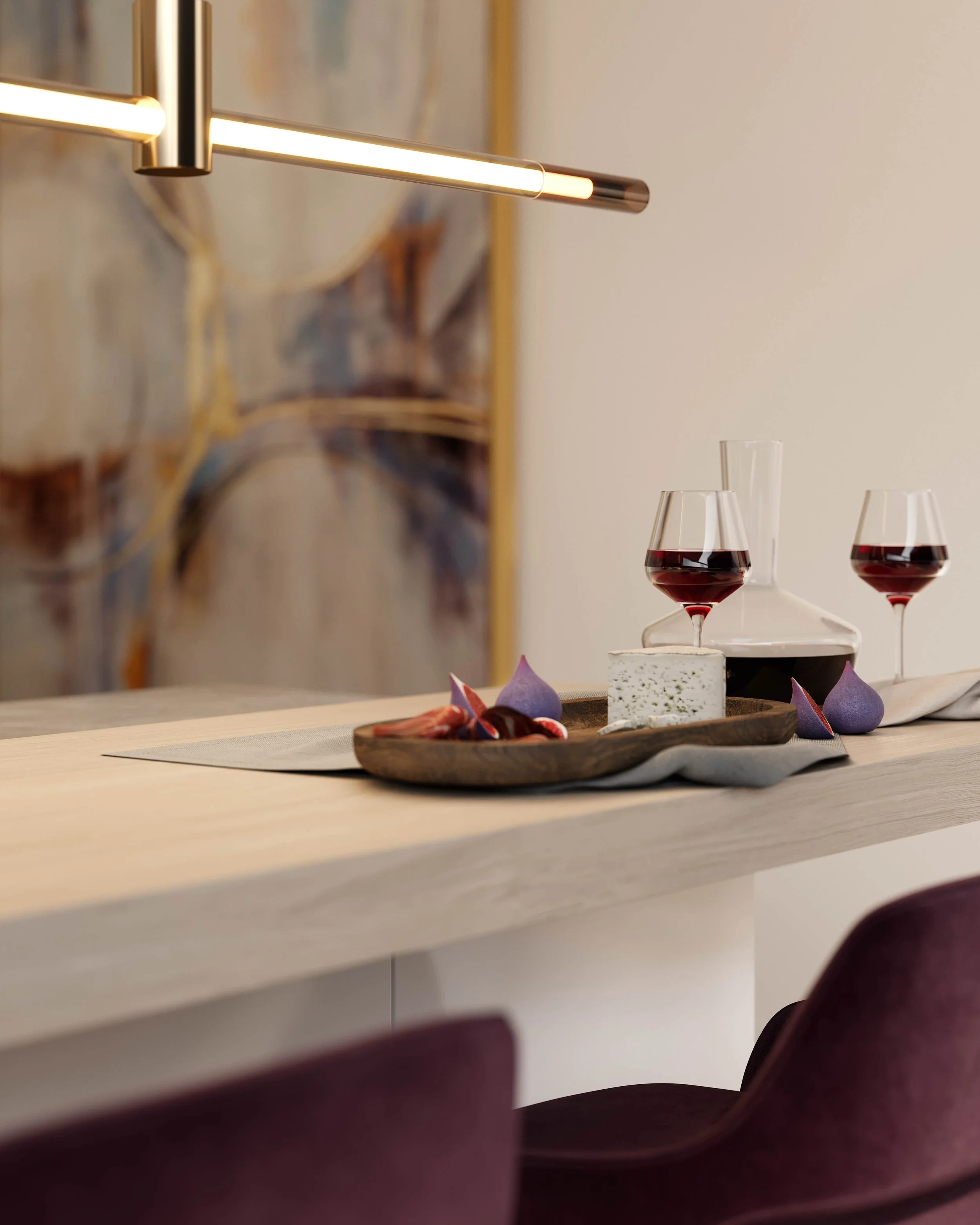 Part of a modern chandelier light fixture on a wall, with three glasses of red wine and some purple and pink decorative items on a wooden tray on a white surface below.