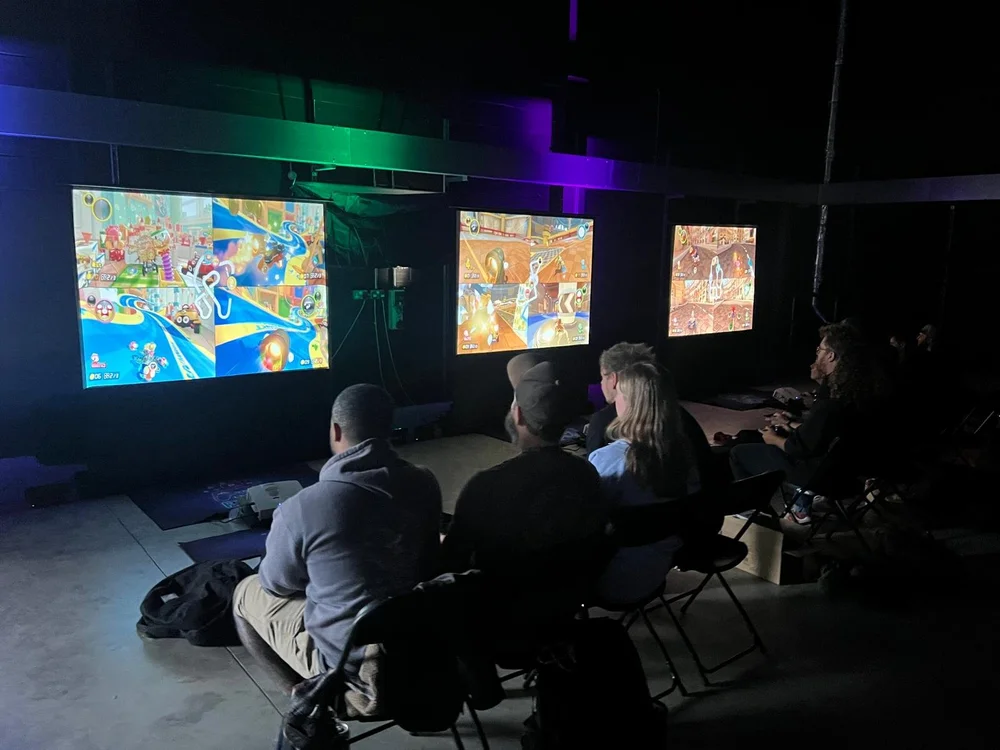 Pupils gaming together in a school space
