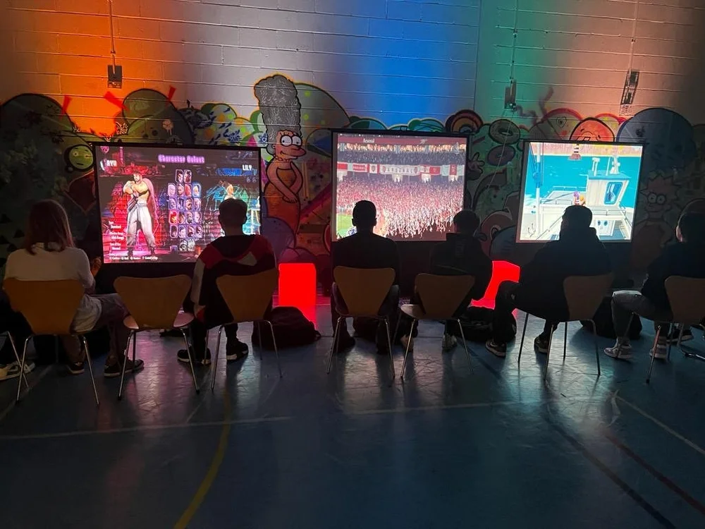 Corporate guests playing on gaming screens