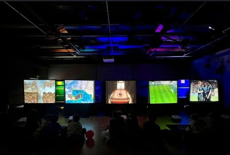 Multi-screen gaming area for guests