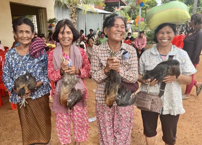 Cambodia women with hens.jpg