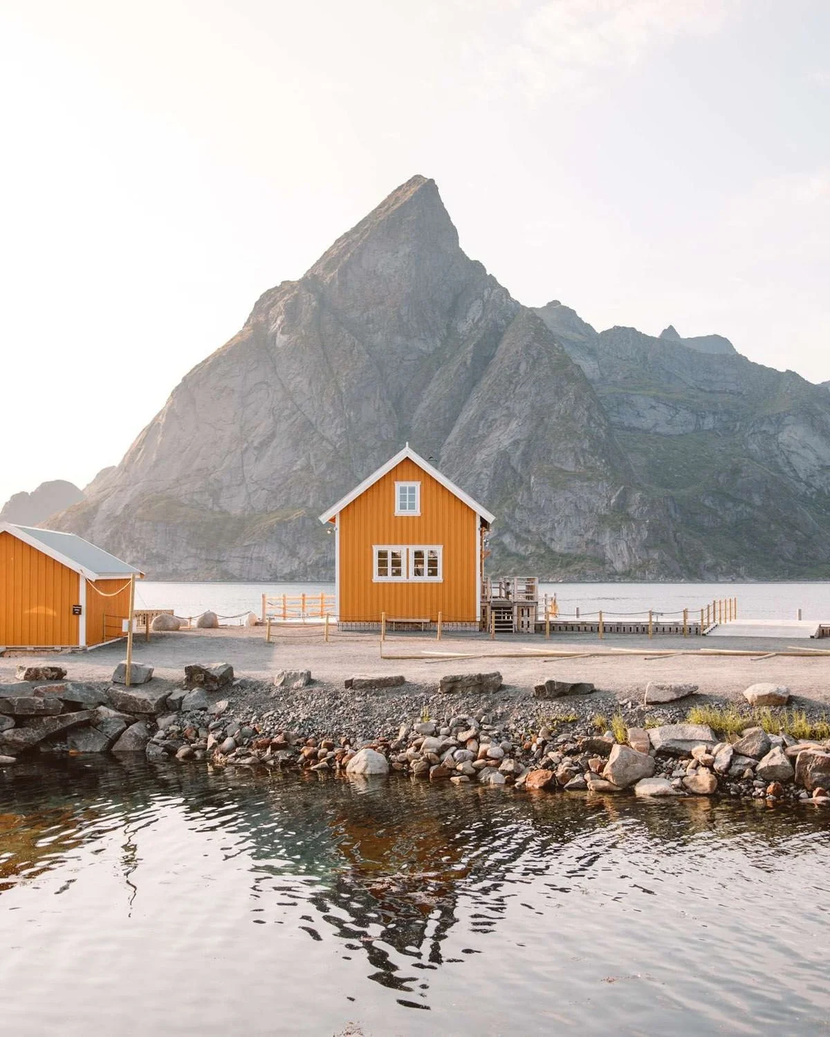 lofoten-yellow-fishing-cabin-rocky-shore-norway