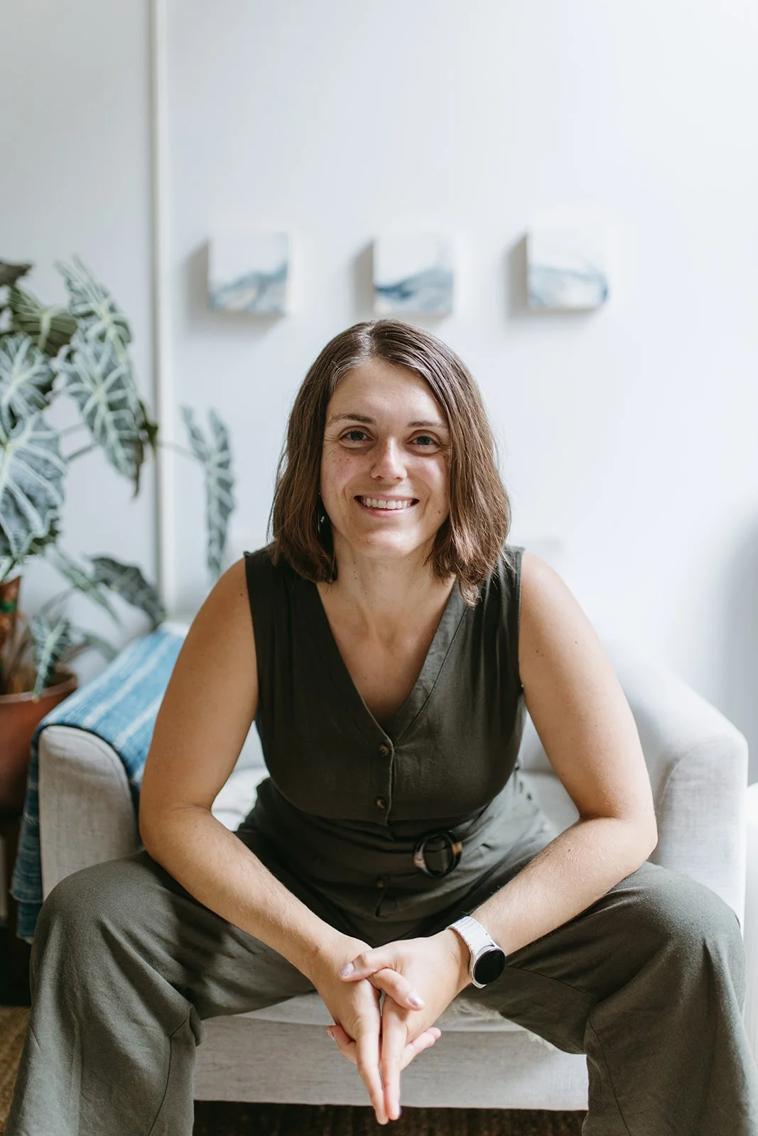 Michelle Jones, with calm, focused smile, leaning forward
