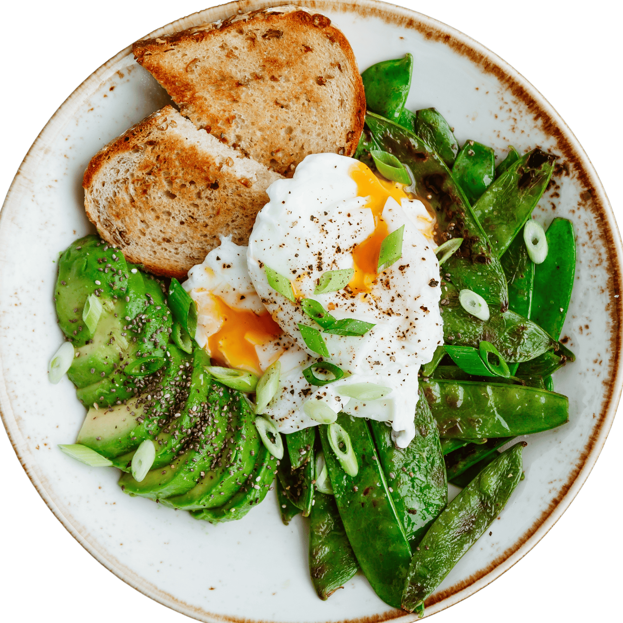 Petit-déjeuner salé à base d’œufs pochés, avocat, épinards et pain complet, dressé dans une assiette gourmande.