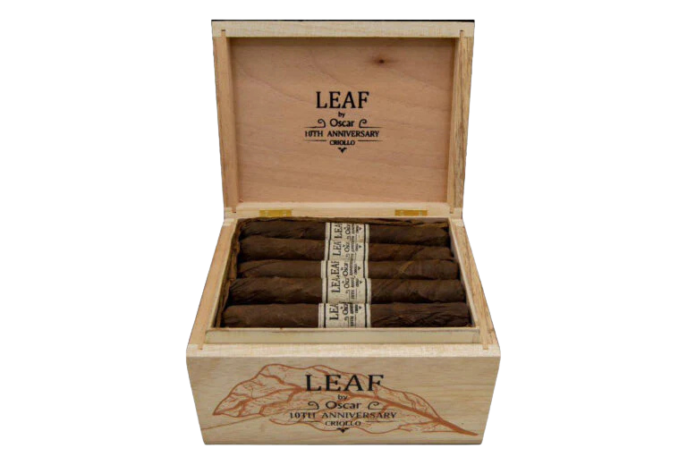 An open wooden box containing cigars wrapped in dark brown tobacco leaves, with the word 'LEAF' printed on the inside of the lid and on the cigar band.