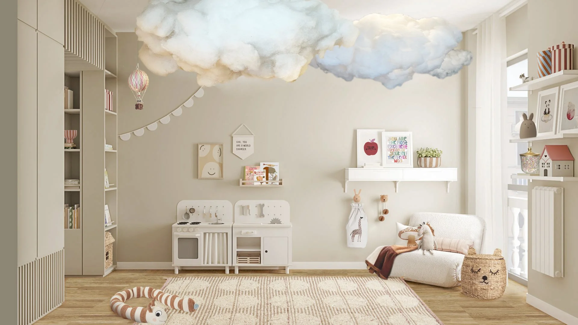 Zona gioco di una nursery per gemelle con nuvole sospese, cucina giocattolo, libreria su misura e angolo lettura.