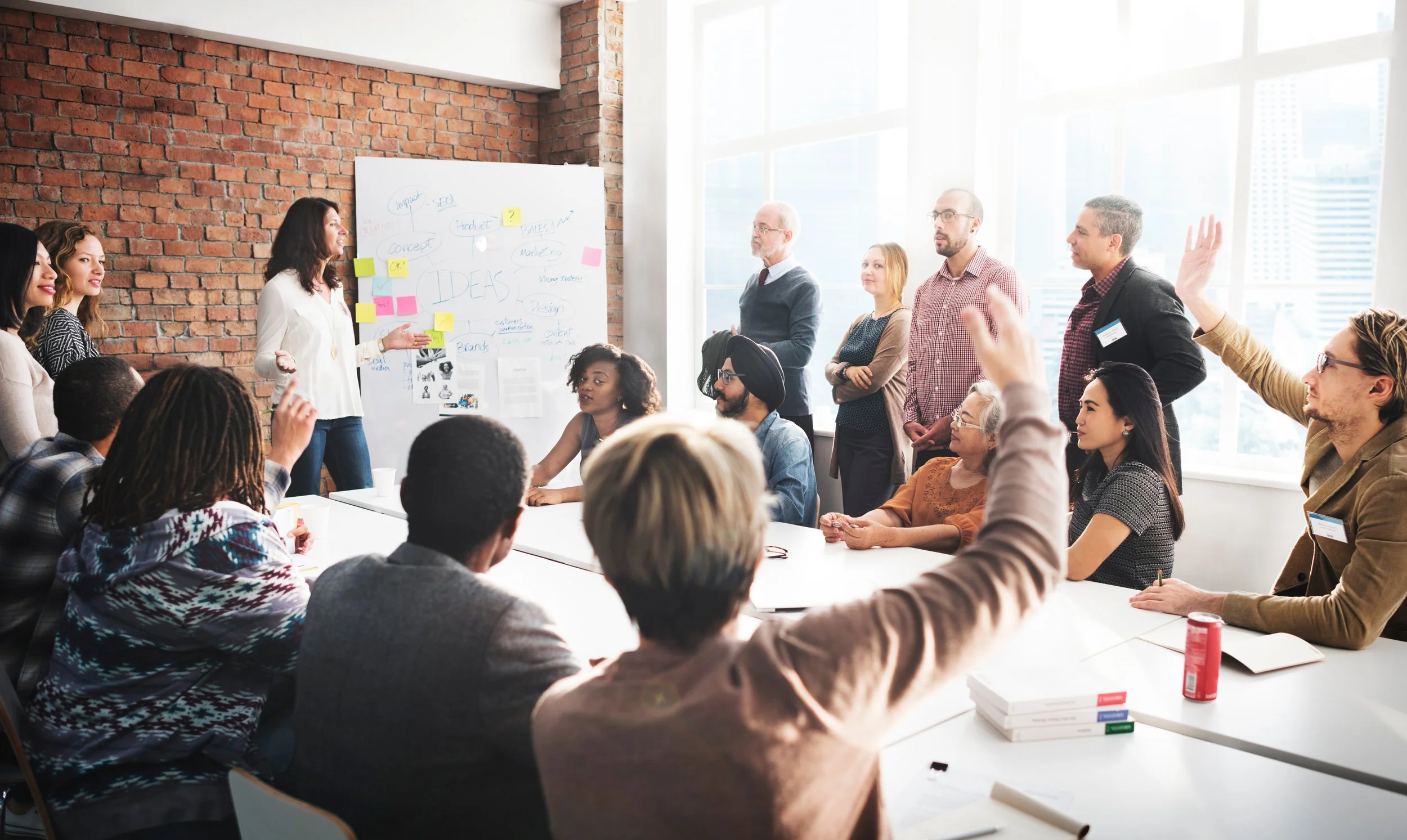 Large group of people collaborating at work