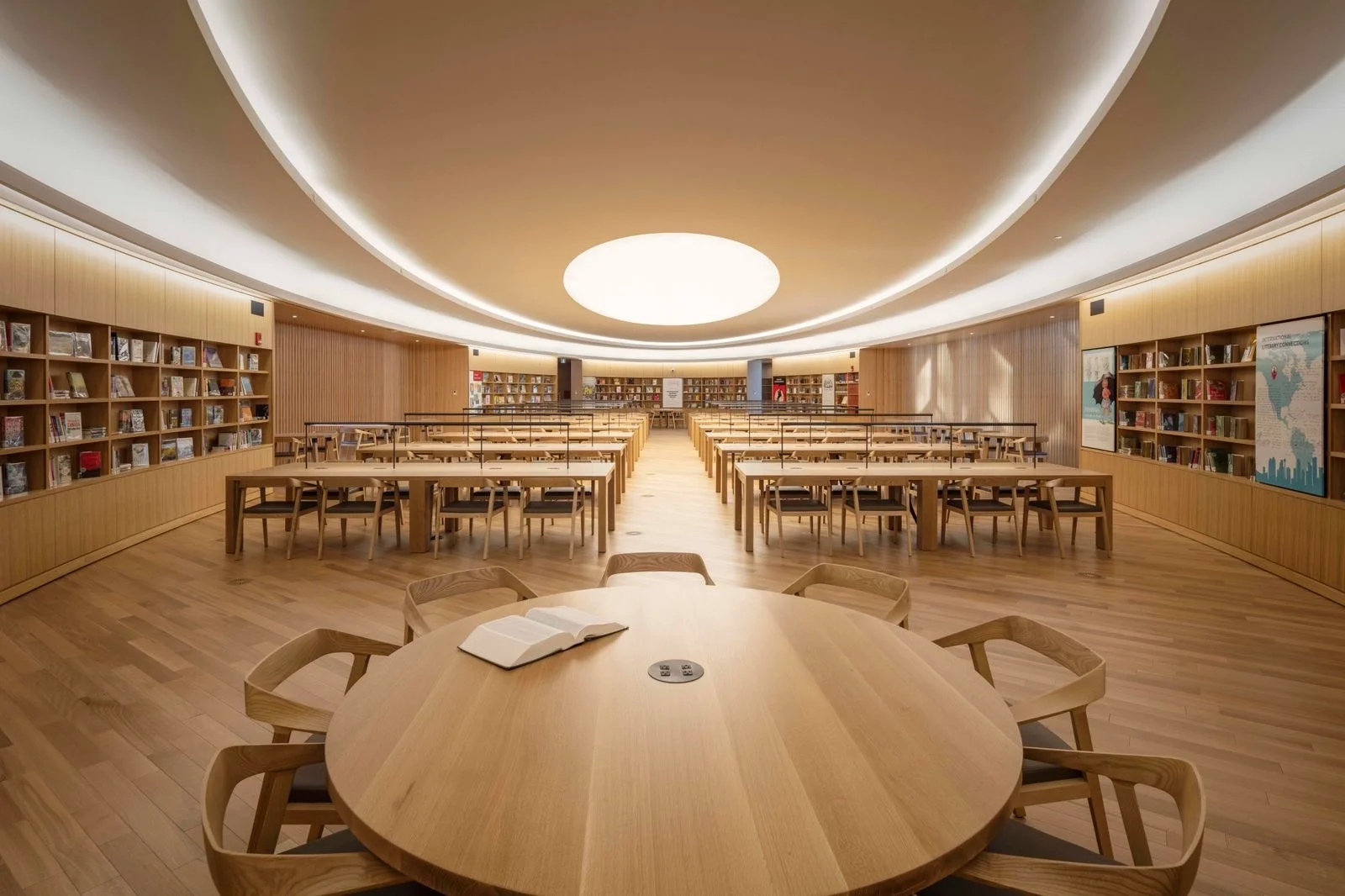 Quiet reading space inside a contemporary public library designed to support focus, calm, and acoustic comfort.