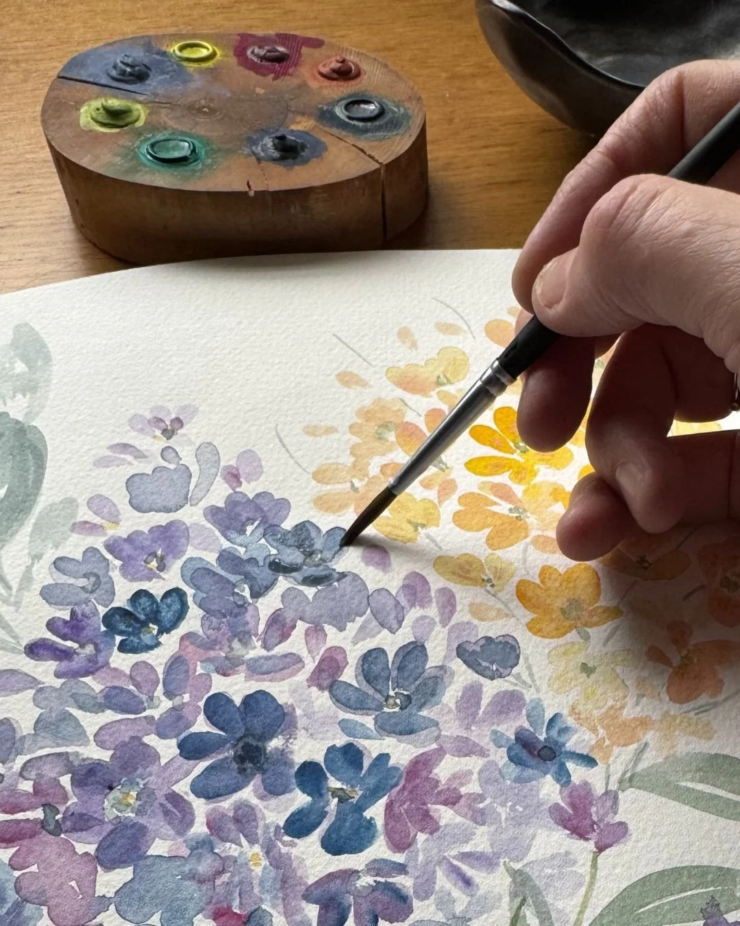Before a linen napkin ever graces your table, it begins here &mdash; at the watercolor table. 🎨

Each petal, leaf, and brushstroke is painted by hand, layered in soft washes and unexpected colors, until it feels alive.

That&rsquo;s the quiet heart 