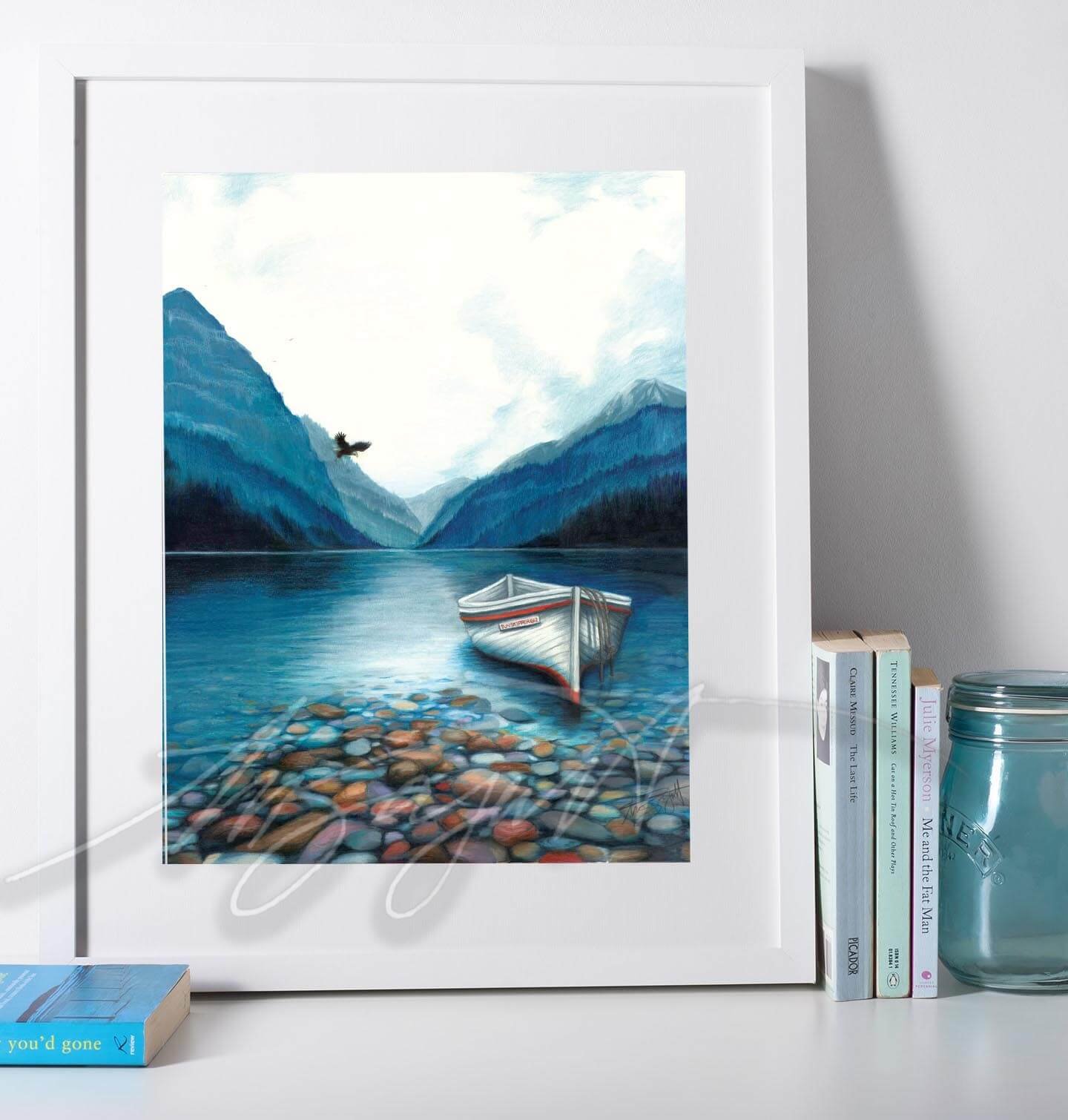 mountain lake and boat in frame on table.jpg