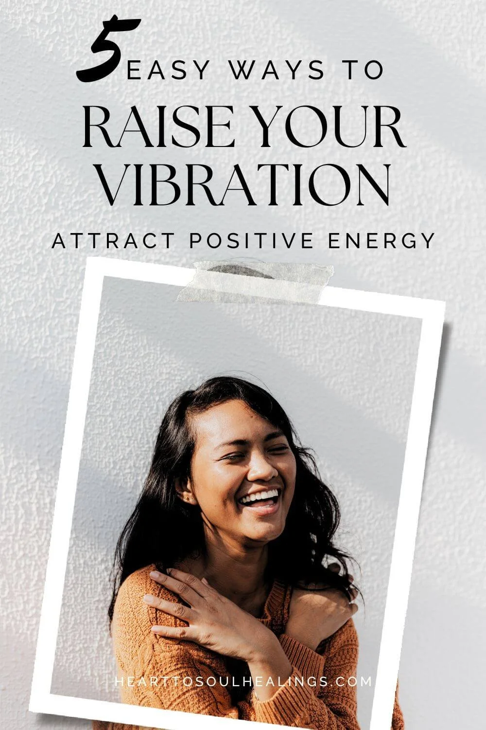 woman smiling with hands over shoulders