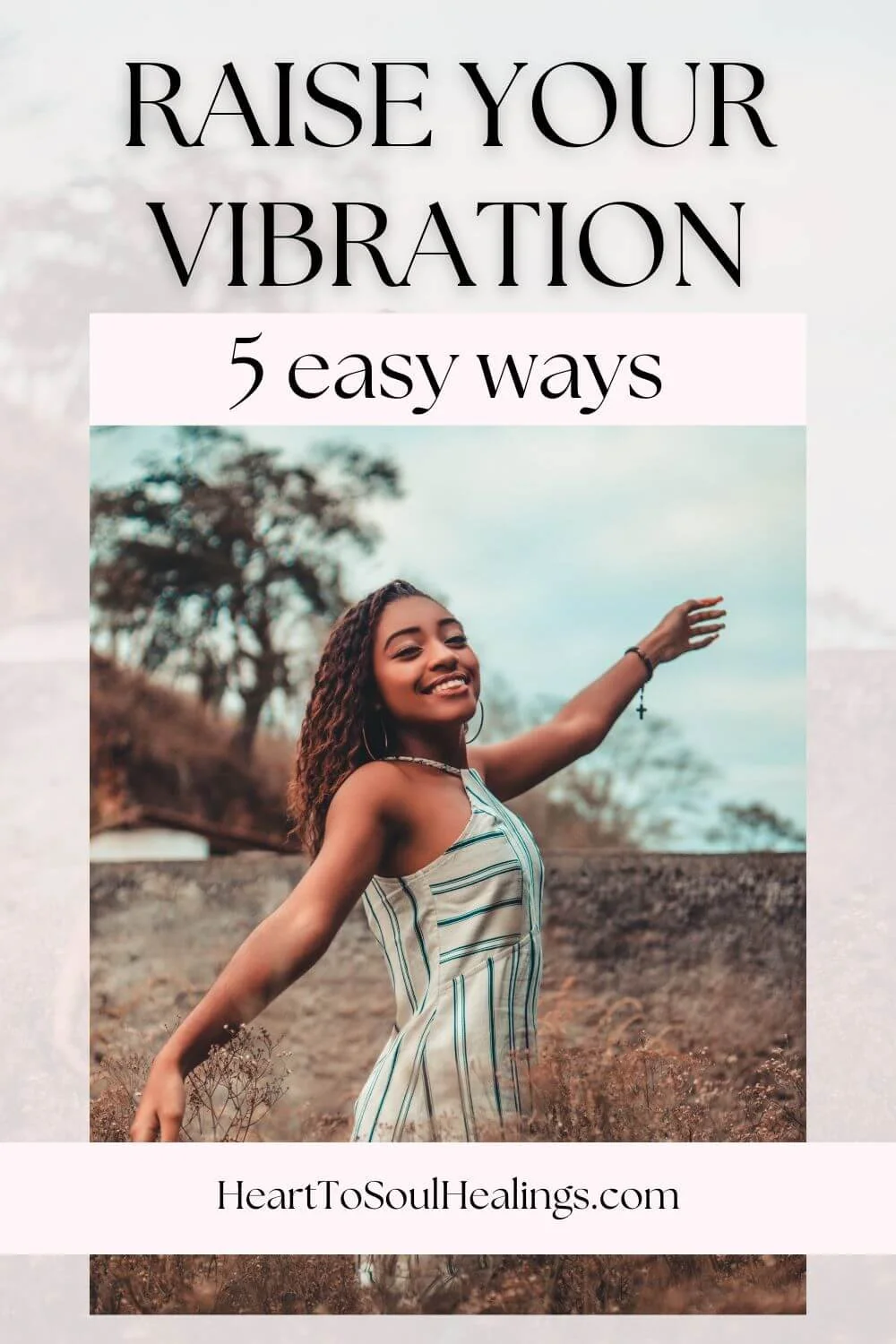 woman smiling with hands in the air