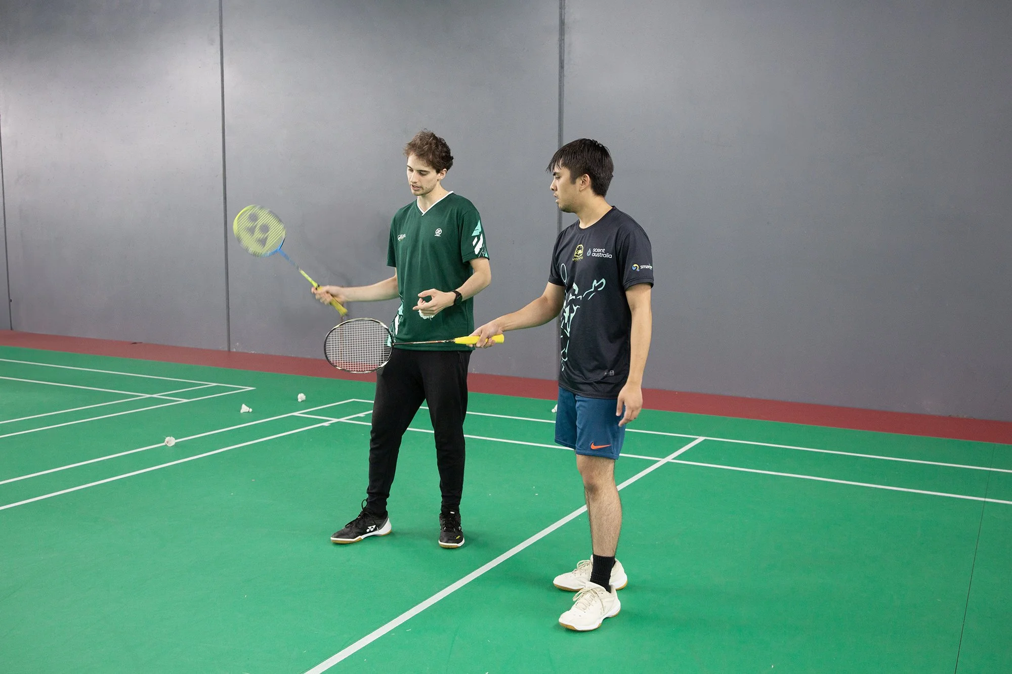 Adult badminton player during a Technique & Match Play session at Elite Athlete Academy