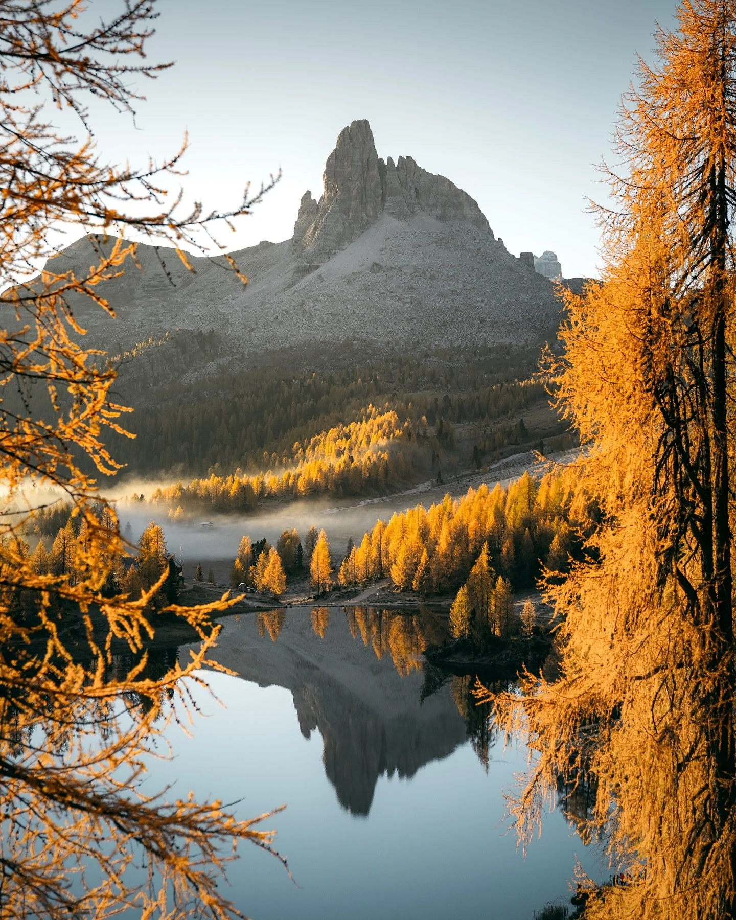 It&rsquo;s no secret that fall is especially beautiful in the Dolomites, but seeing it for the first time was even more of an experience than I expected. We started hiking in the night to reach this lake for sunrise, and what I didn&rsquo;t realize w