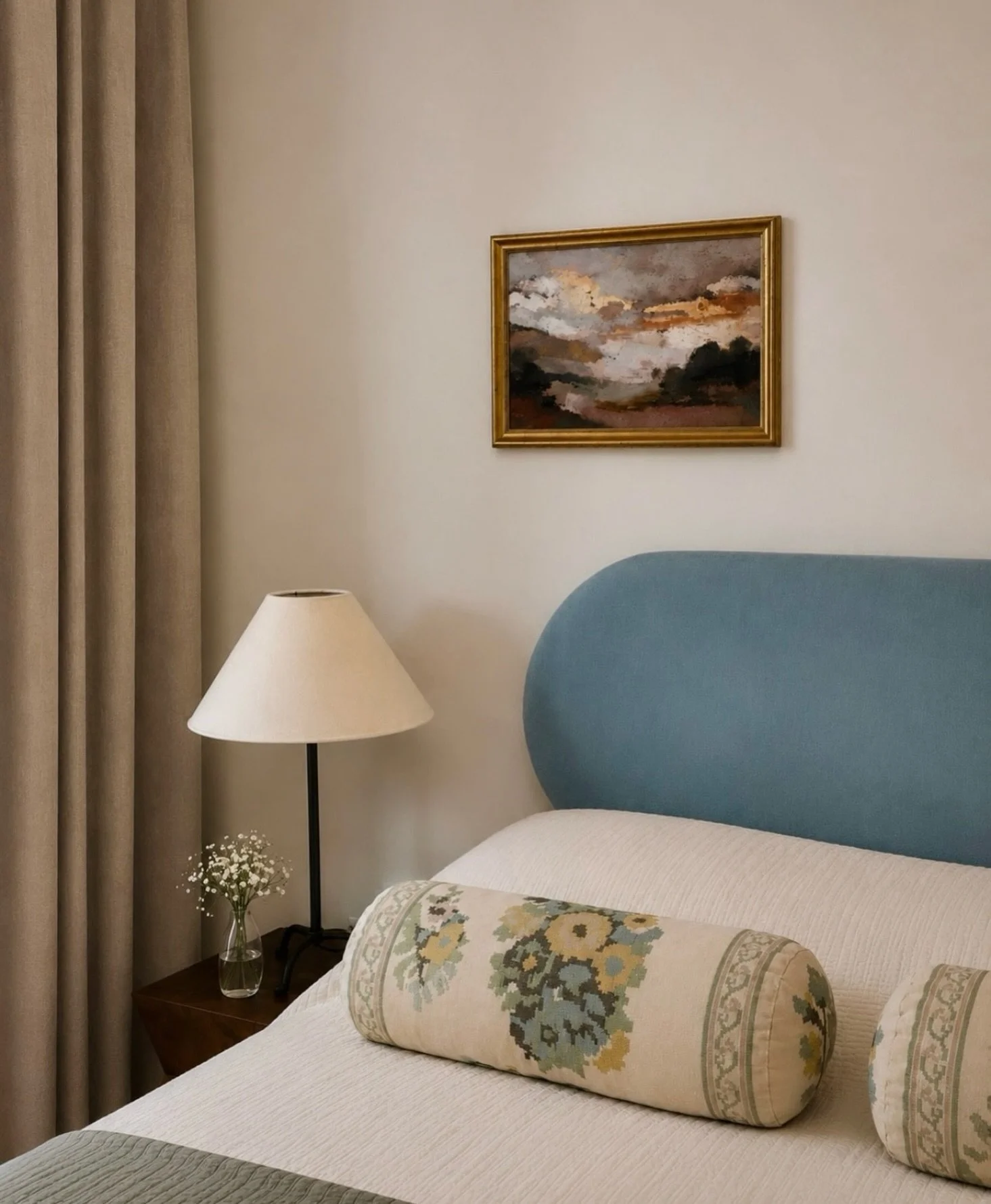 A bedroom grounded in softness, restraint, and timeless detail 

Inspired by the understated elegance of old world French interiors, this space layers warm neutrals, muted blue tones, and classic forms to create a feeling that is both refined and cal