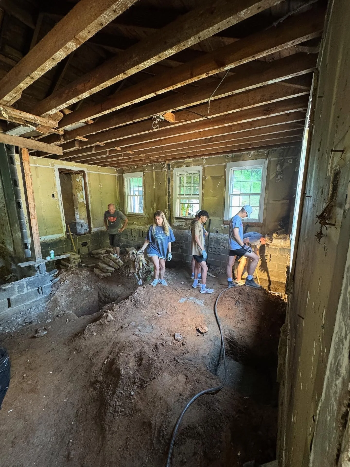 Our teenagers and adults are spending the week in Western North Carolina working on disaster relief from hurricane Helene. Their project begins with setting concrete piers to lay a new foundation for this home&rsquo;s floor system. Keep them in your 