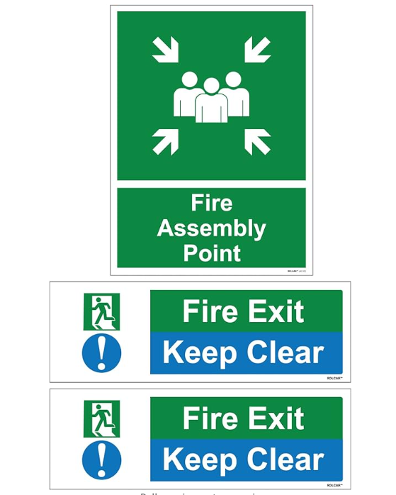 Set of safety signs including a green "Fire Assembly Point" sign with white arrows and figures, and two "Fire Exit Keep Clear" signs with green and blue backgrounds, featuring an emergency exit symbol.