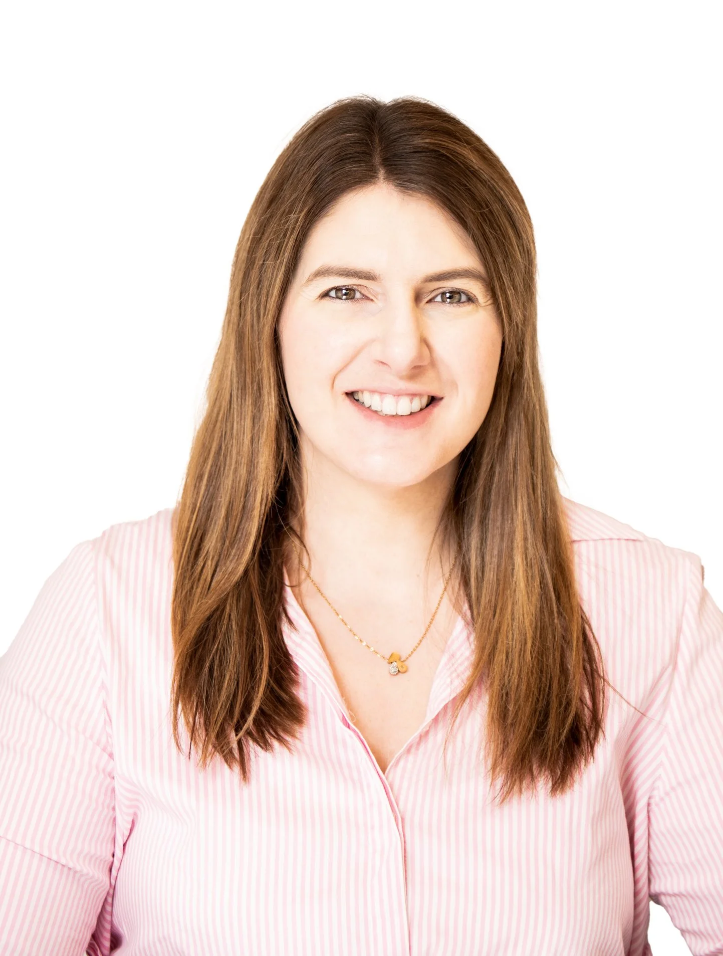 Woman smiling in a pink striped shirt