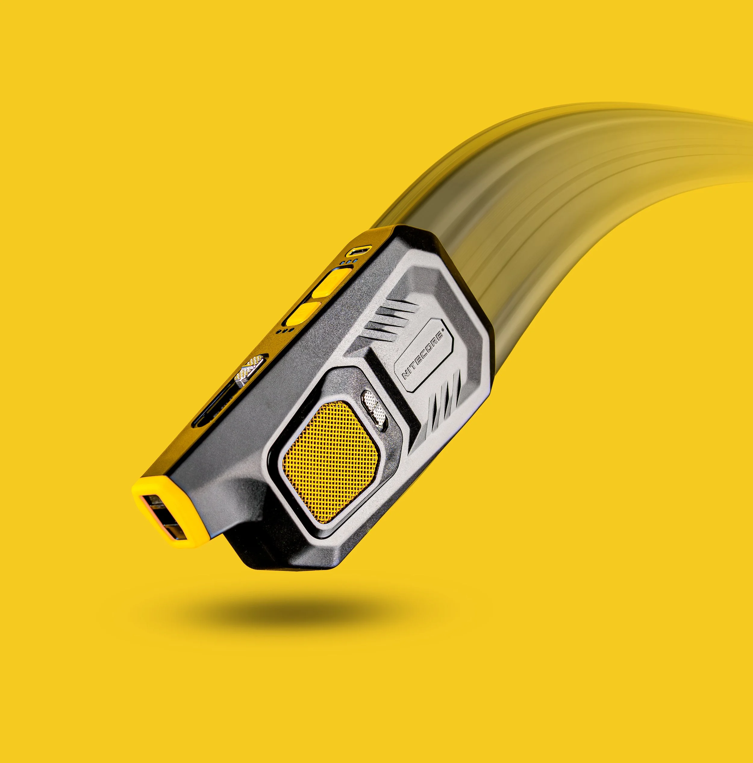 Black and yellow handheld device on yellow background
