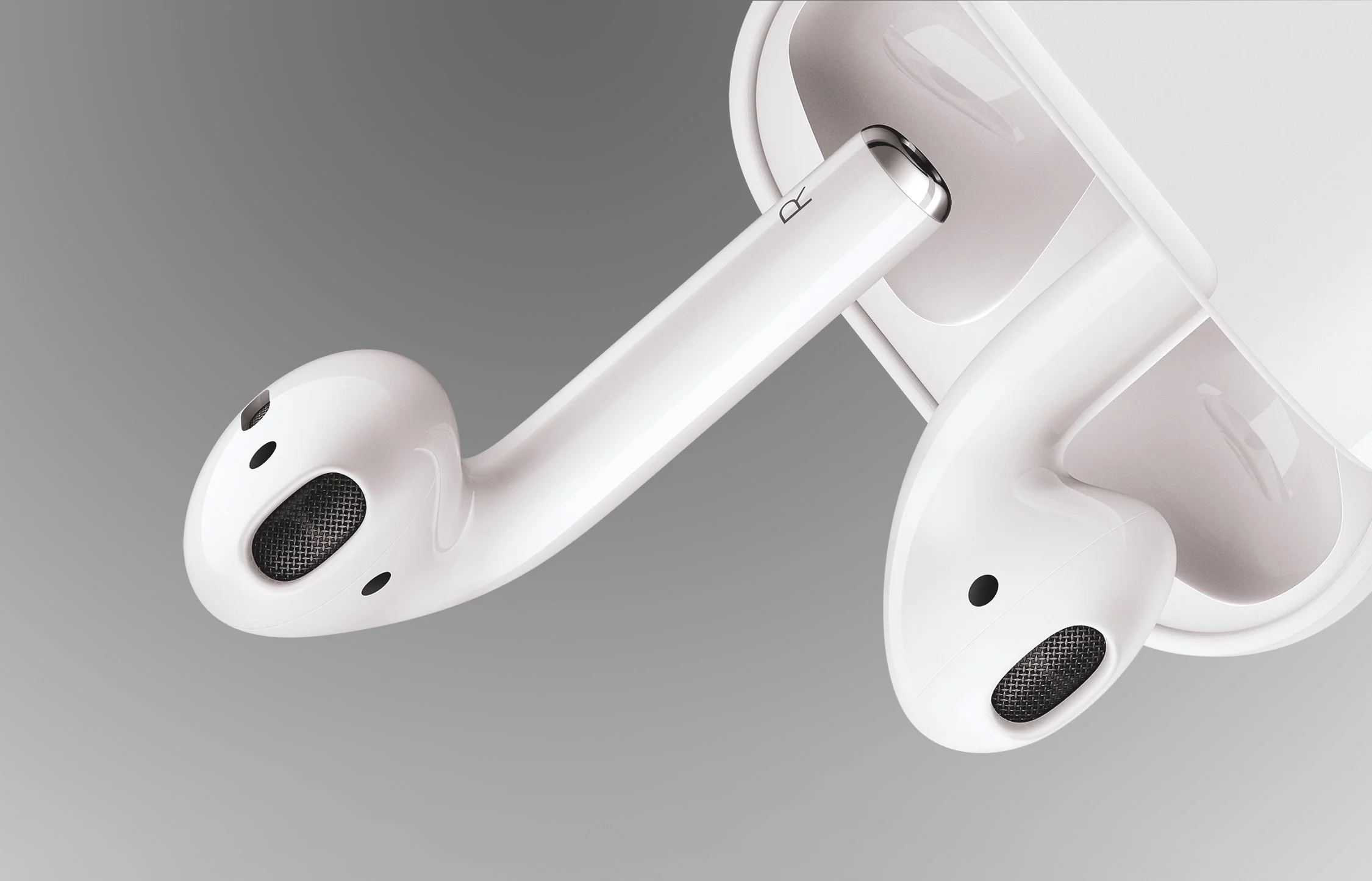 Close-up of white wireless earbuds in a charging case.