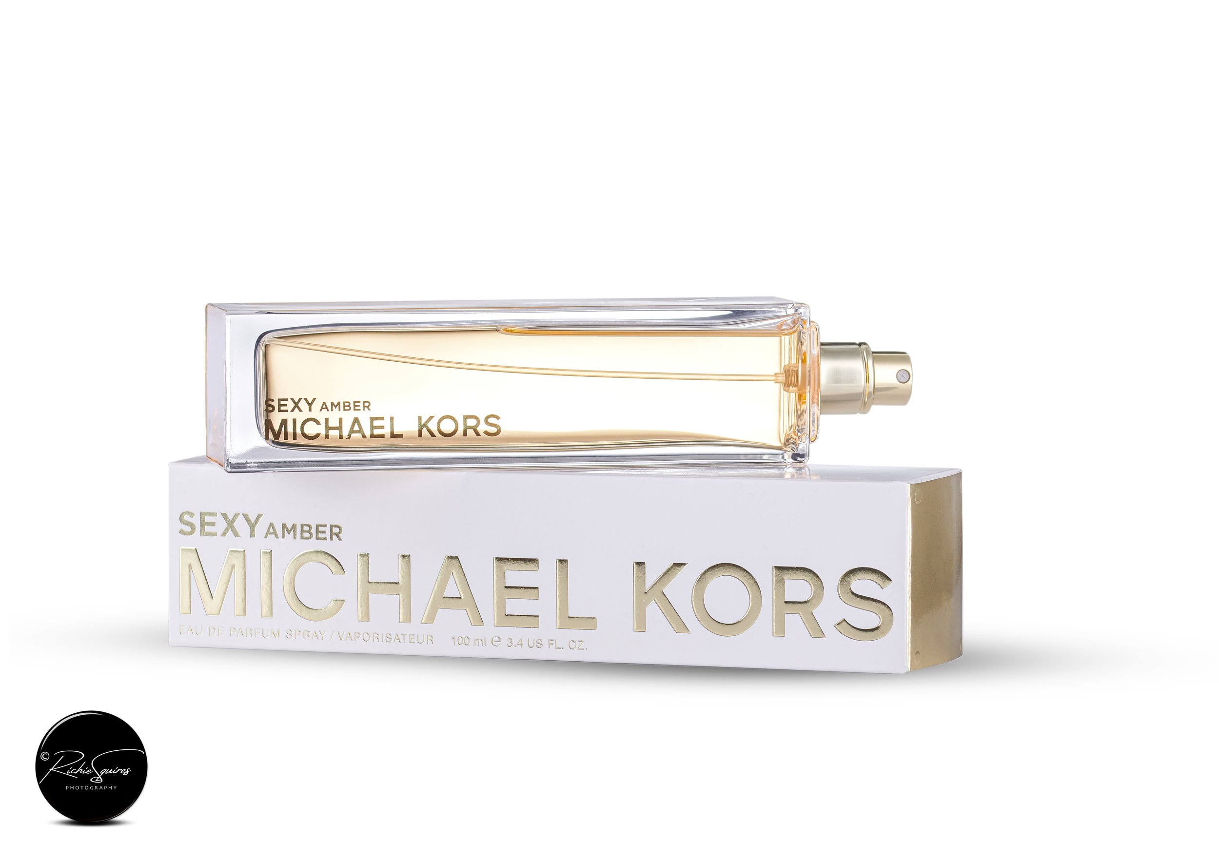 Michael Kors Sexy Amber perfume bottle and packaging.