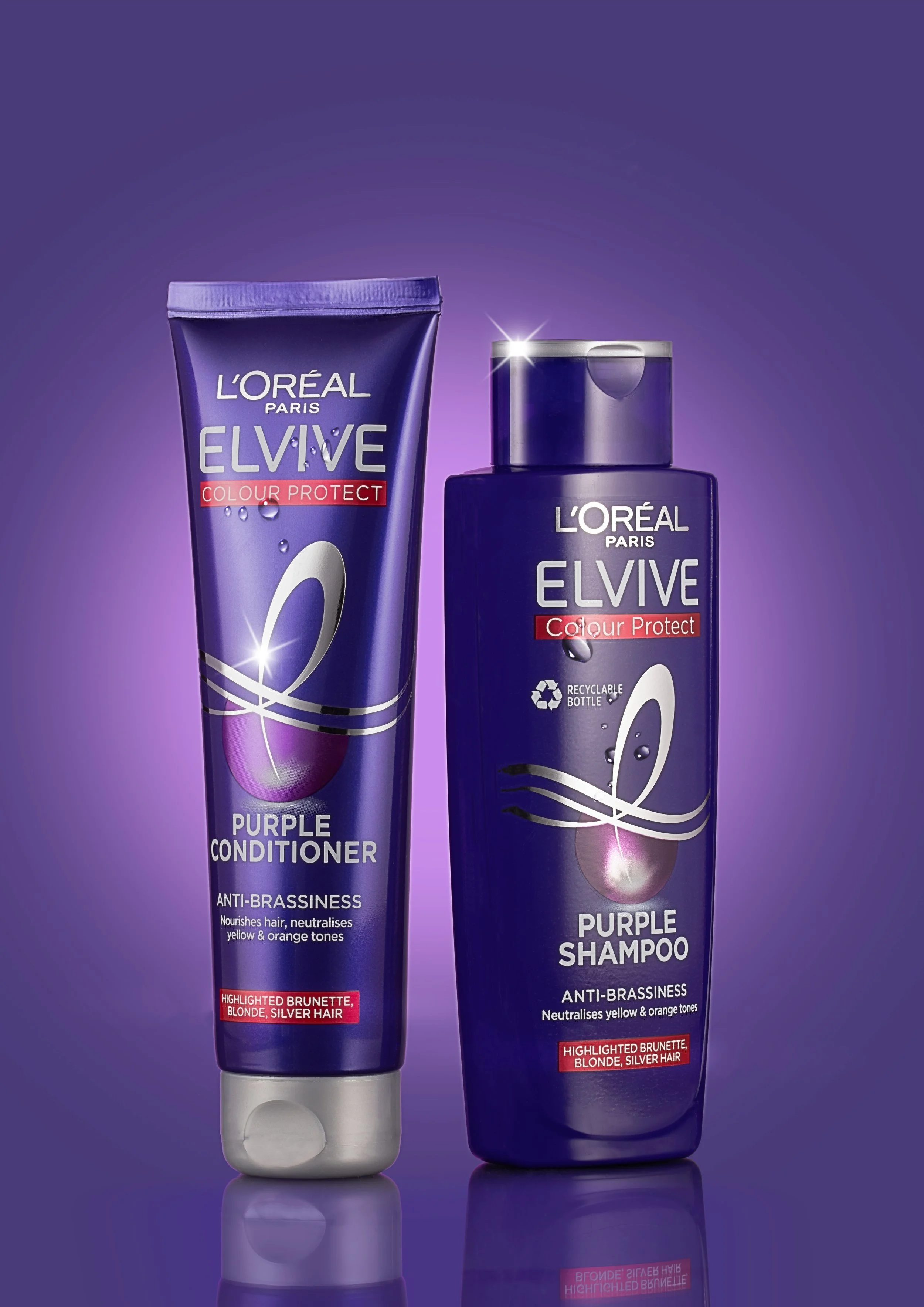 L'Oreal Paris Elvive Color Protect purple shampoo and conditioner bottles against a purple background.