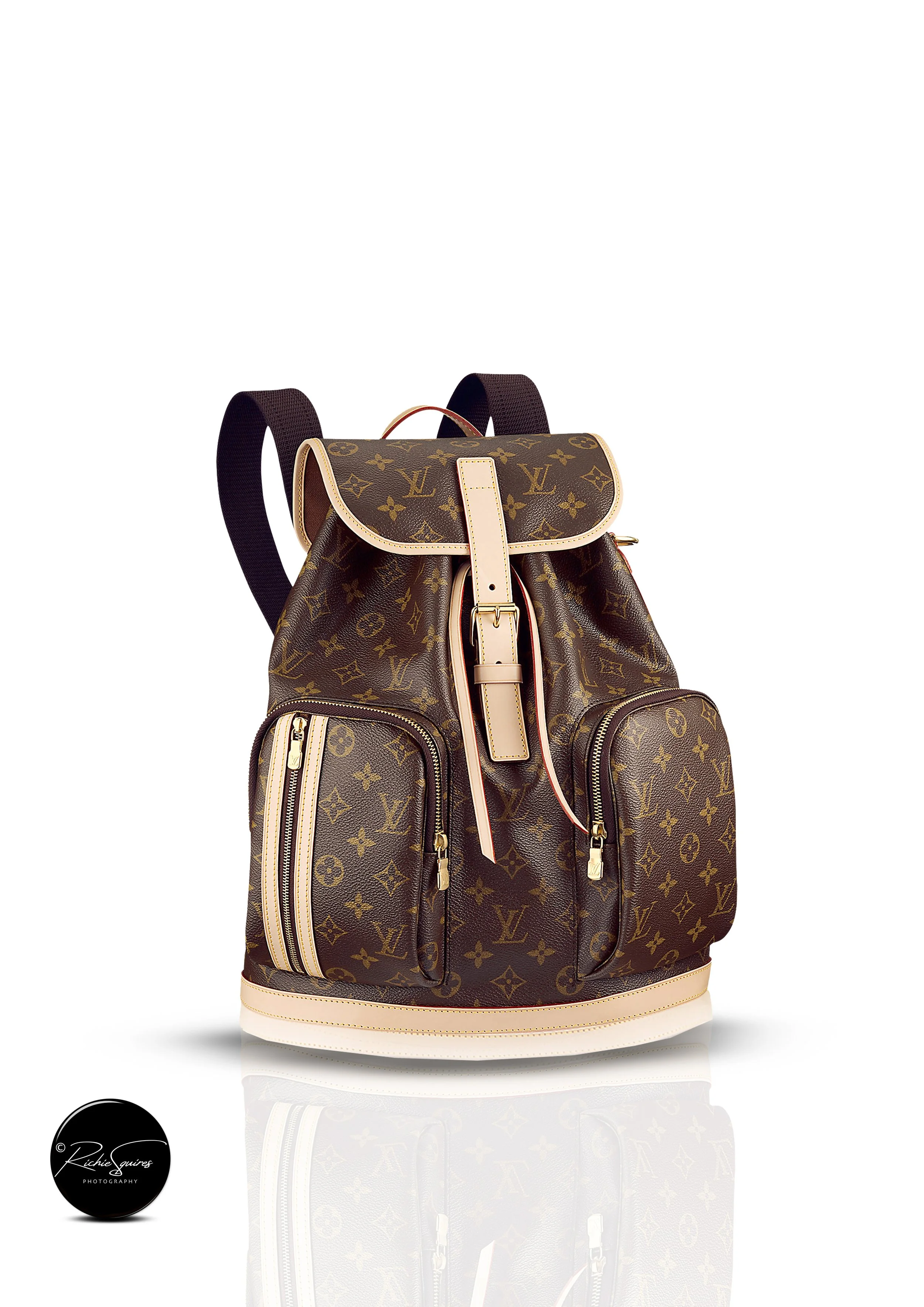 Luxury brown monogram backpack with gold zippers and leather straps, displayed against a white background.