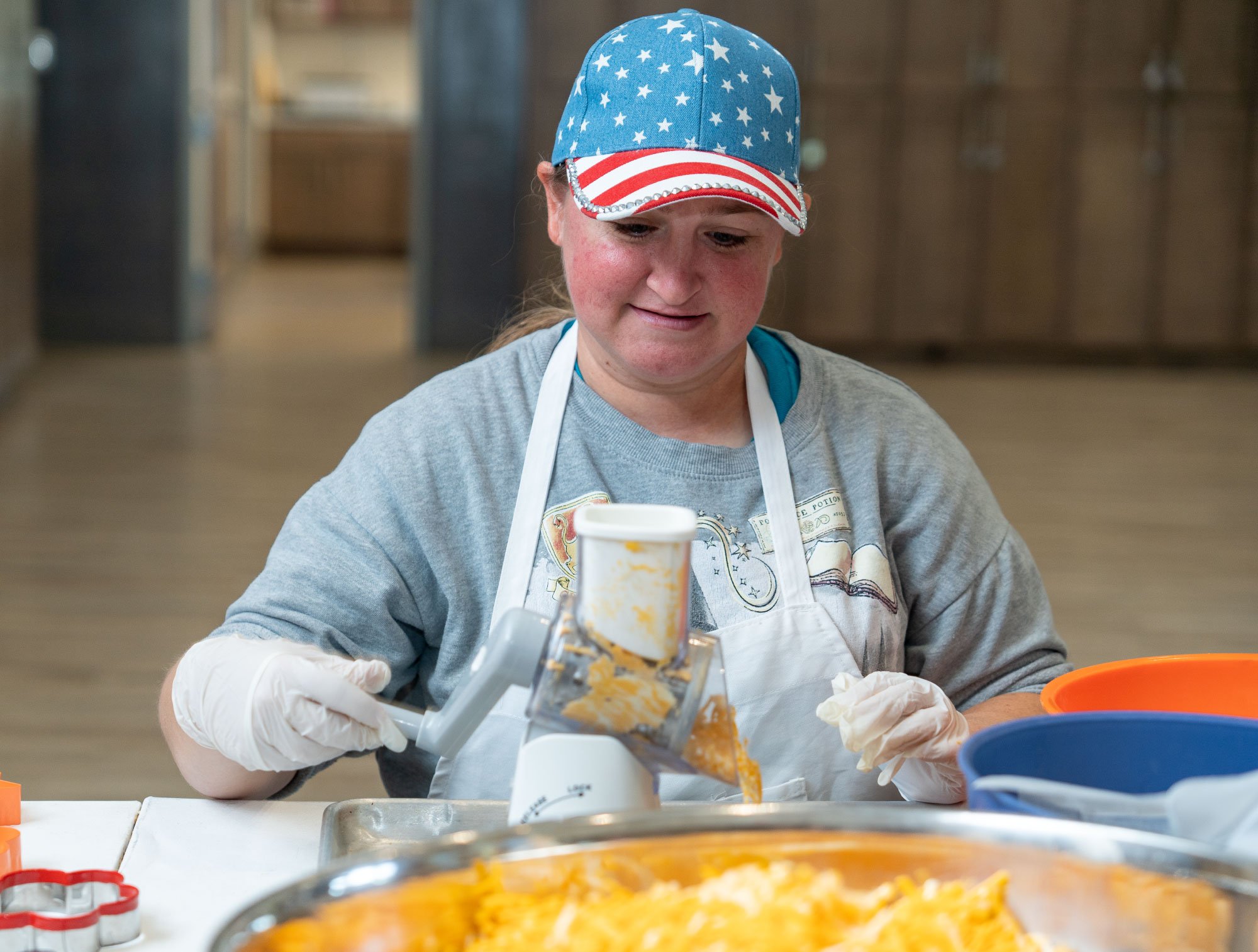 Woman-with-American-hat-and-white-apron-preparing-baked-goods.jpg