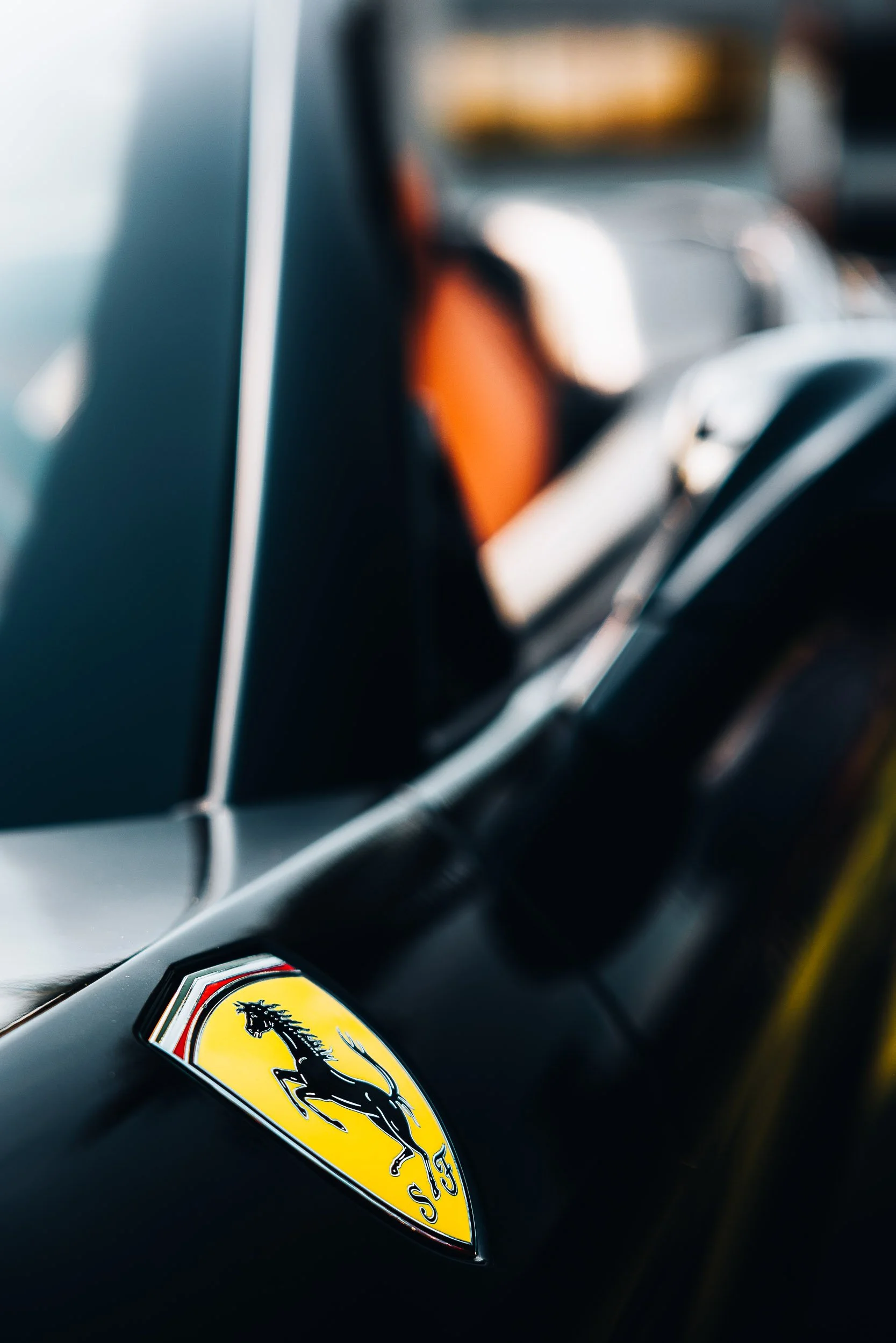 Close-up of Ferrari logo on a car