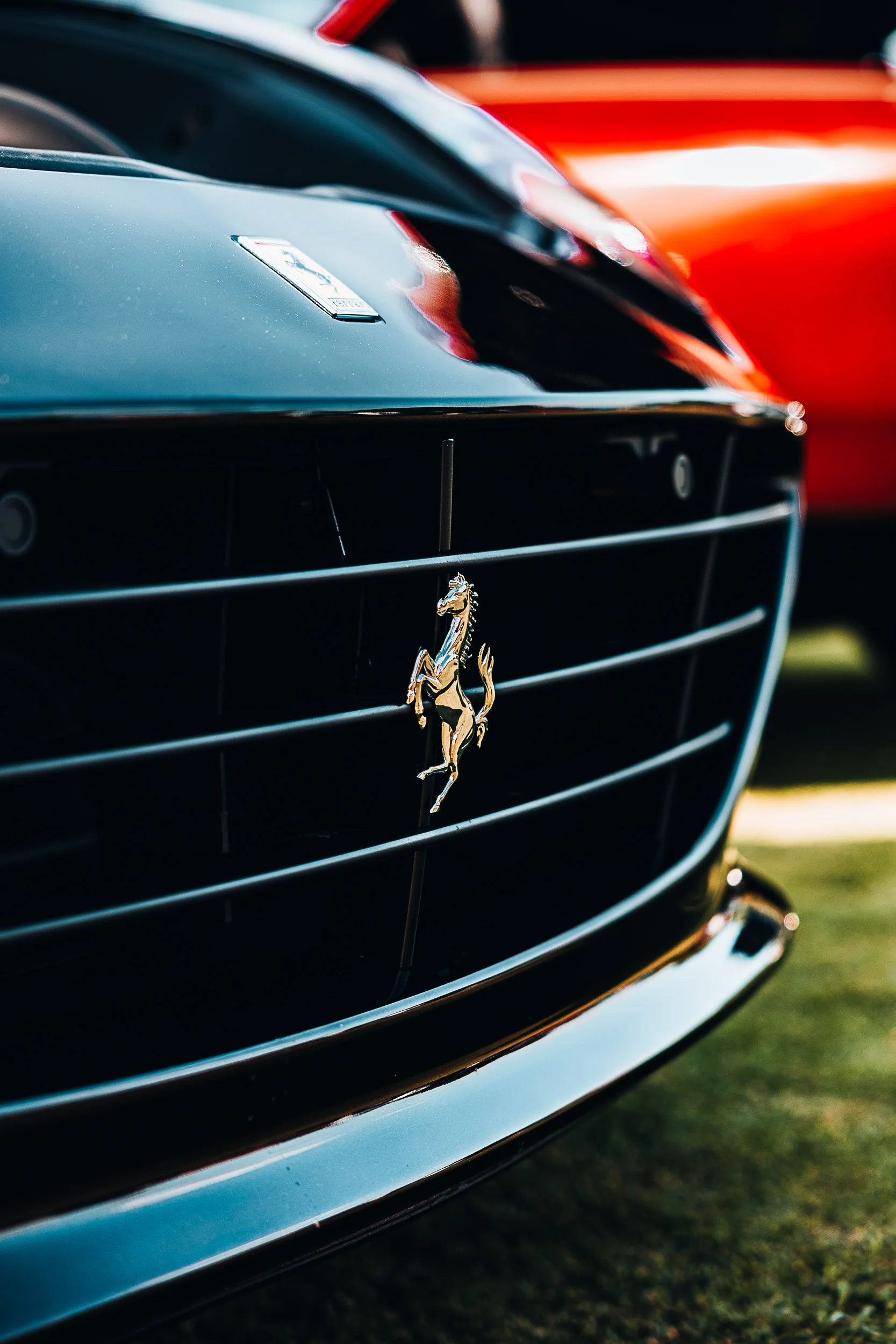 Close-up of a Ferrari car grille with the Ferrari logo