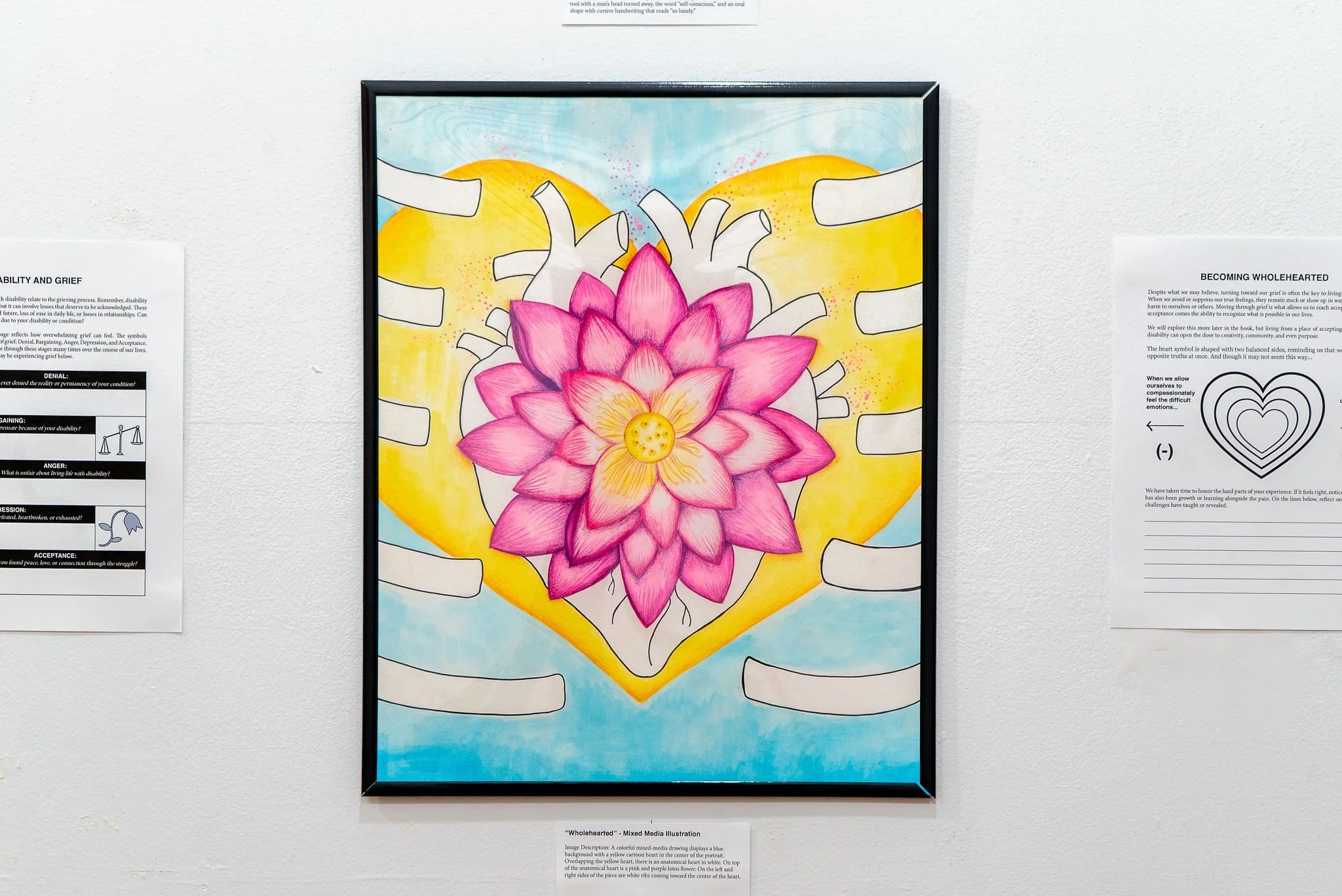 "Wholehearted"; Mixed Media Drawing; 9 x 12"; Fall 2025; Image Description: A colorful mixed-media drawing displays a blue background with a yellow cartoon heart in the center of the portrait. Overlapping the yellow heart, there is an anatomical hear