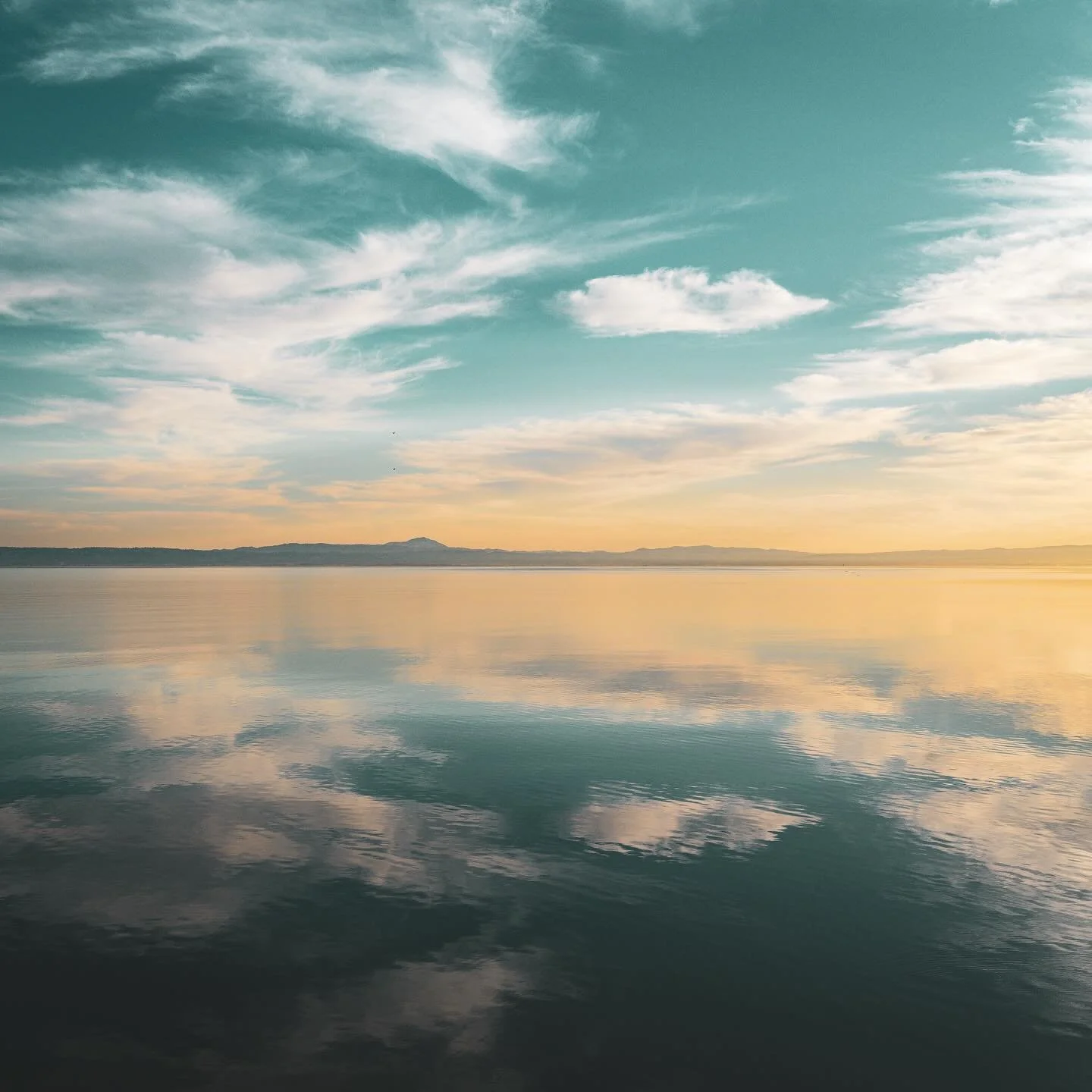 The horizon dissolves into still water and open sky&mdash;where reflection feels endless and time slows to a whisper.

#peacefulwaters #horizonmagic #skyreflections #quietmoments #serenescape #cloudmirror #natureheals #sunsetcolors #stillnessspeaks #