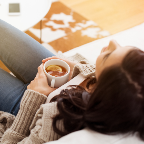 woman relaxing with a cup of tea