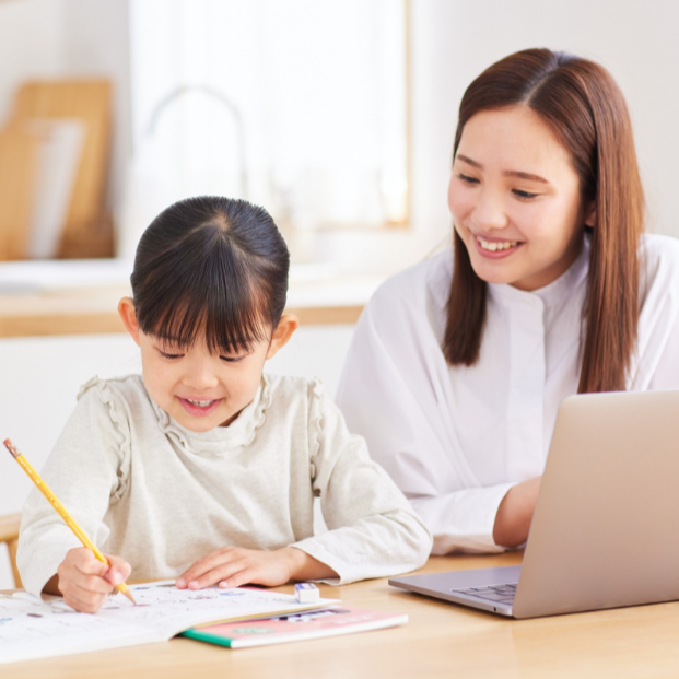 mother helping child with homework