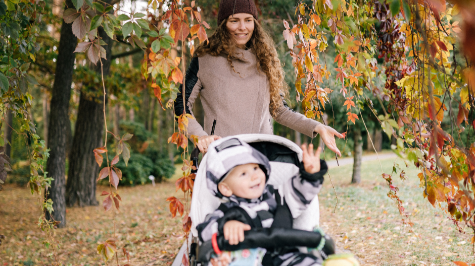 mother walking child in stroller