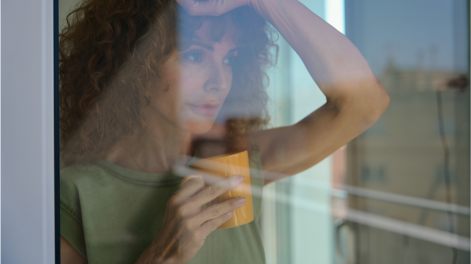 Mum taking a quiet moment with a cup of coffee at home