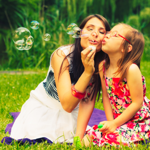 mother and child blowing bubbles