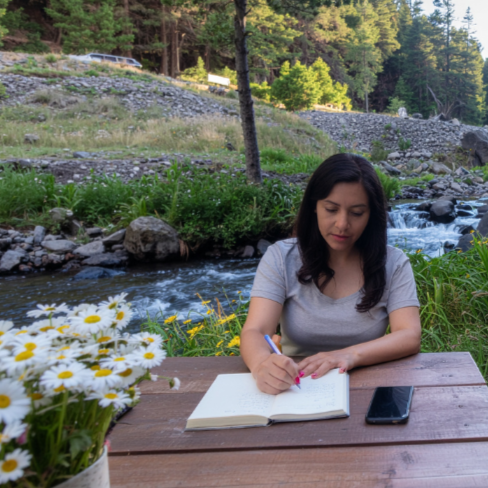 woman journaling in nature