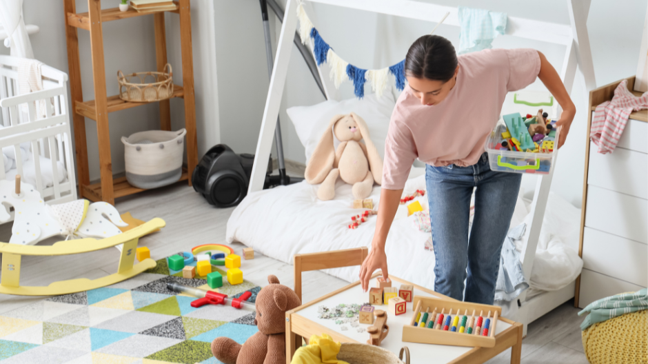 mother tidying up the nursery