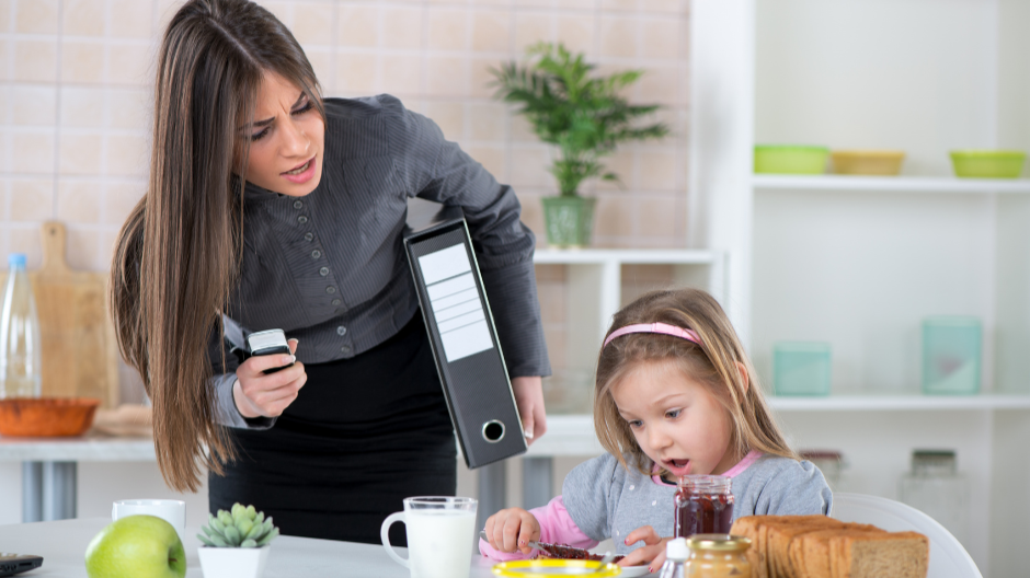 mother hurrying her child to finish breakfast