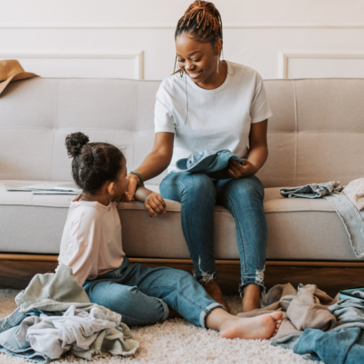 mother organising clothes with child