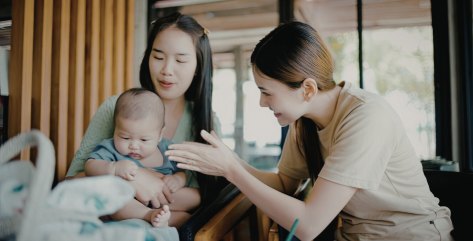 two women and baby