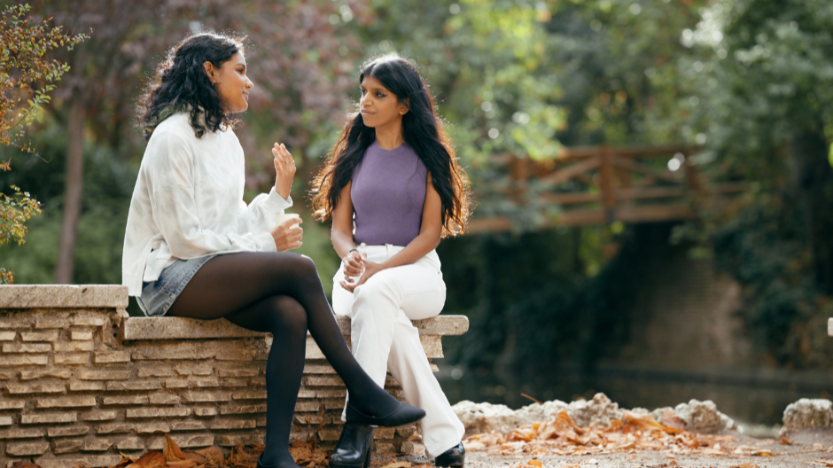 two adult woman friends having a conversation