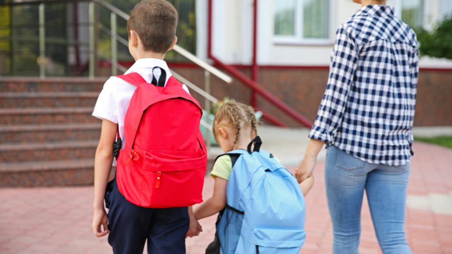 mother dropping her kids at school