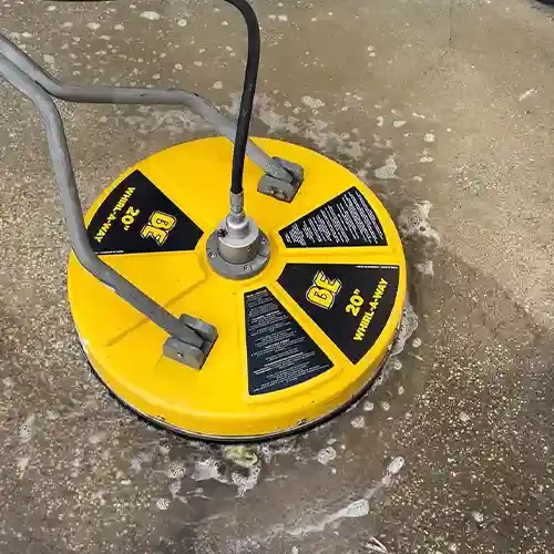 surface cleaner removing mildew buildup off of a concrete driveway in, orlando