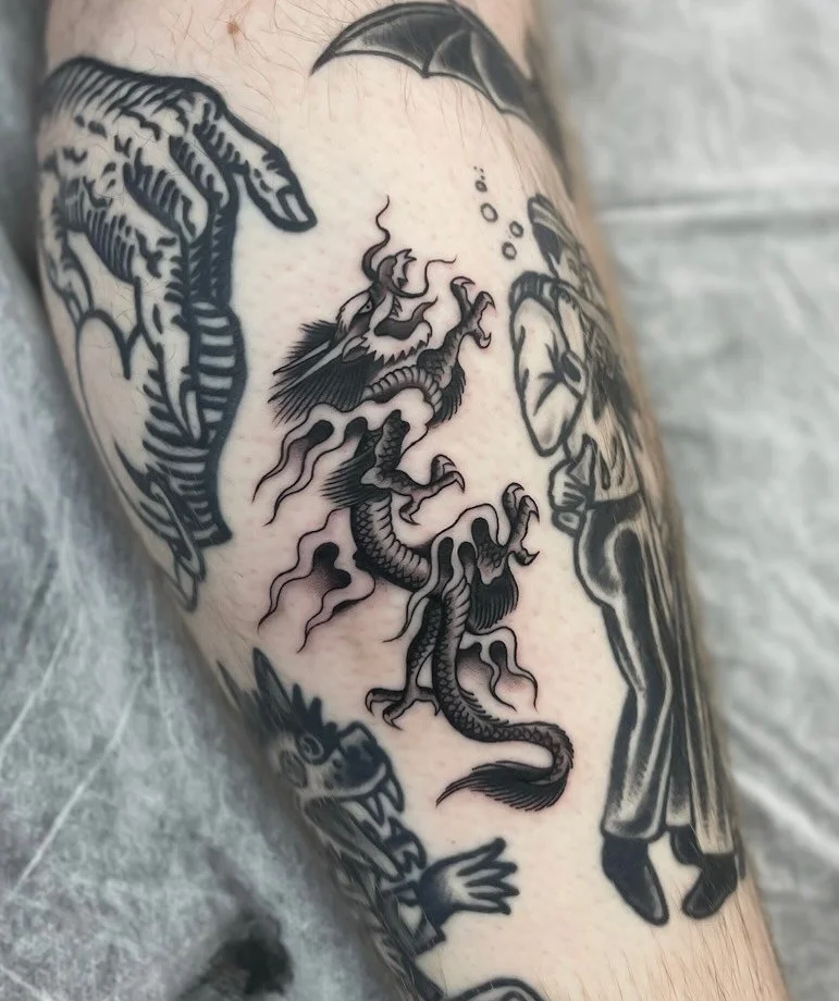 Tiny acetate dragon today for Nick with some extra flames added to fill the space. Thanks again for the trust! ★ ☆ ★ Made at @wa.ink.tattoo