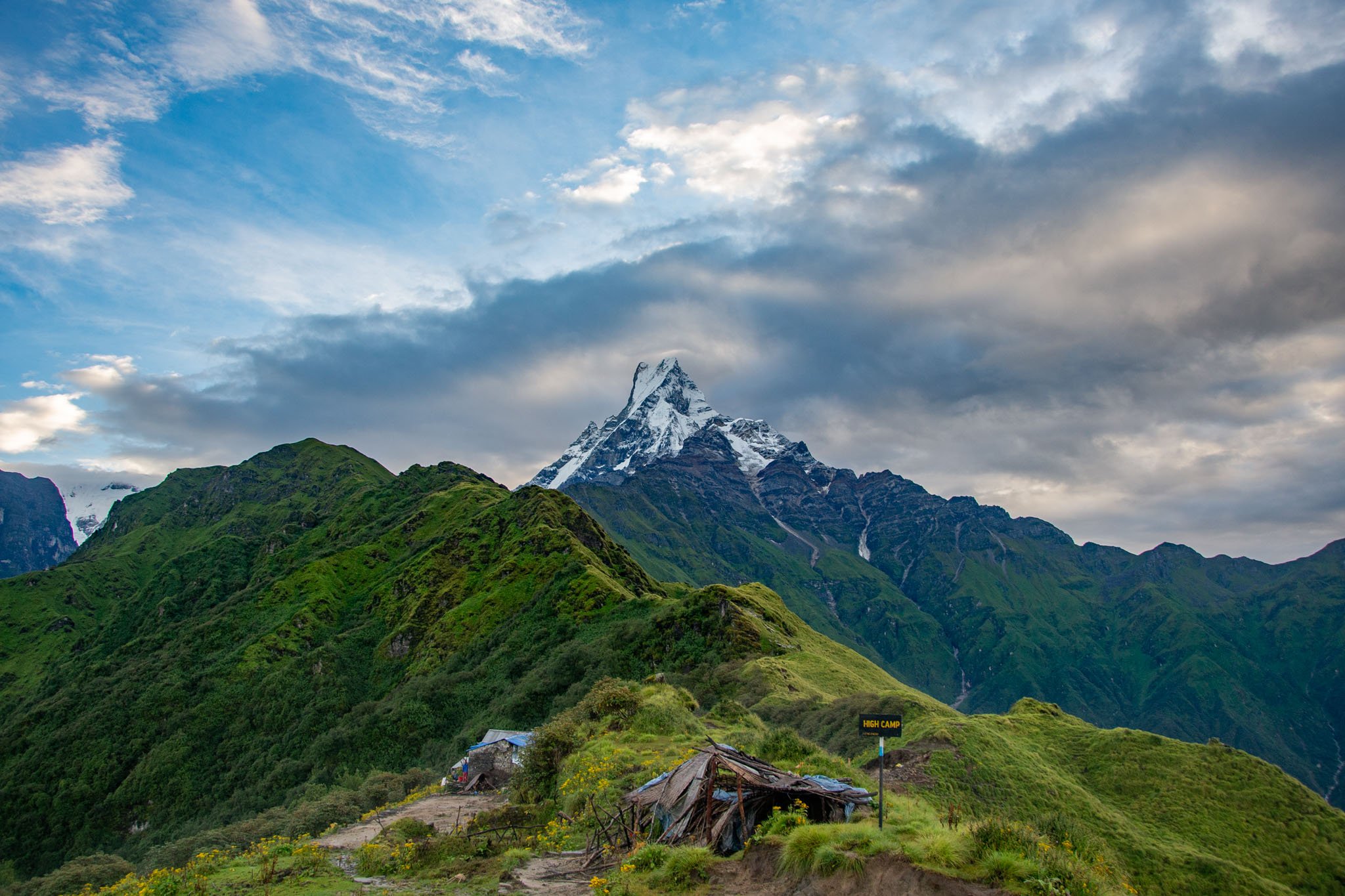 Mardi Himal trail with Machhapuchhare standing tall in the background and lush green hills below